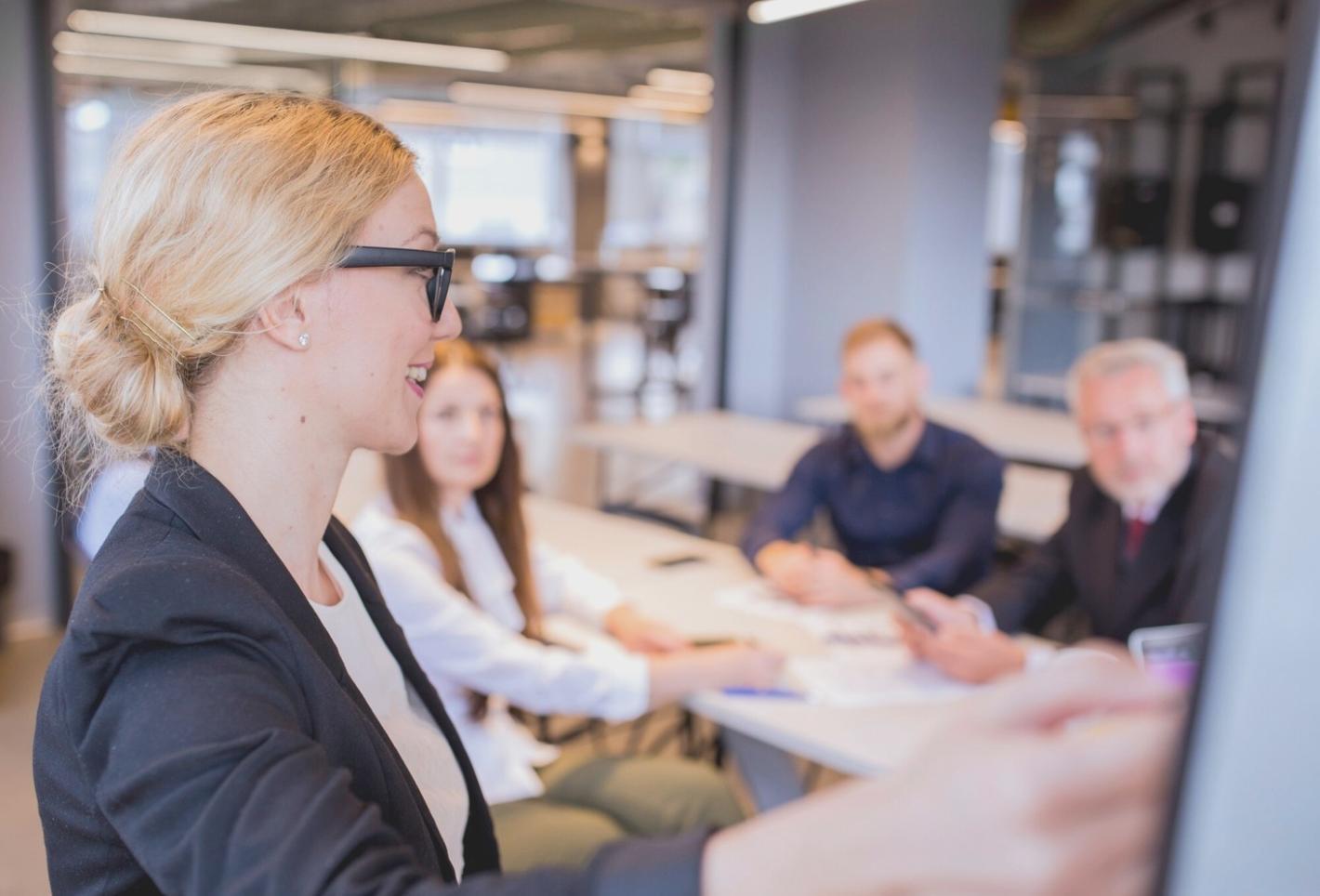 Close-up view of video editing timeline with multiple layers of footage, audio waveforms, and color correction panels