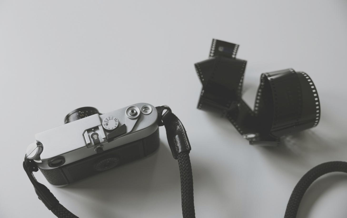 Students working with non-linear video editing software on multiple monitors showing different learning approaches