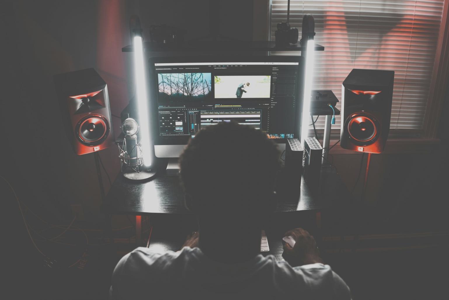 Students collaborating on video editing projects in our modern learning environment